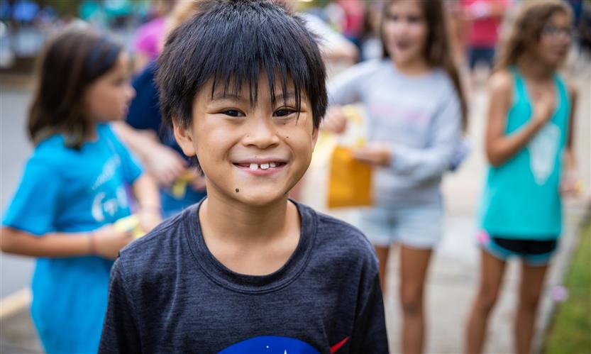 A boy smiles